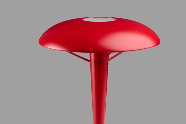 Red Holtkötter floor lamp with arched design – elegant lighting statement piece