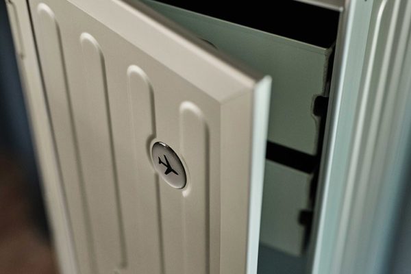 Close-up of partially opened BordBar trolley door with key placed on top.