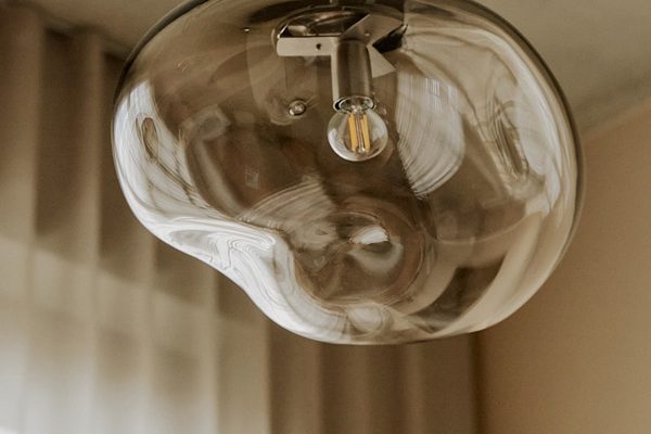 Elegant ELOA single pendant light with soft glow and fluid shape