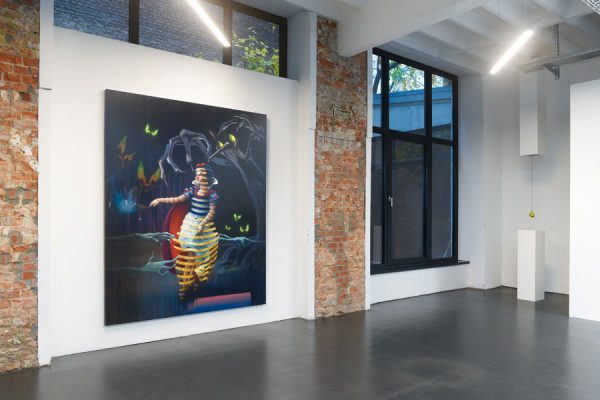 Gallery corner view with window and contemporary artwork on left wall