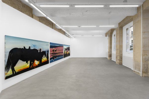Exhibition view at Galerie Droste with three contemporary paintings on the left wall