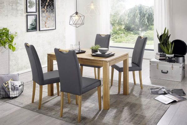 Bright dining space with wooden table and chairs – PLH interior inspiration