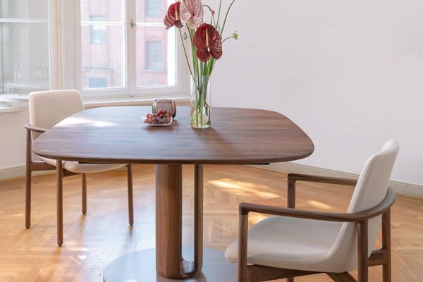 Rodam dining table with two upholstered chairs – clean lines and classic craftsmanship
