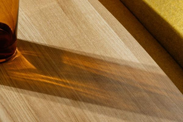 Close-up of Rodam’s illuminated detail in high-end dining furniture – craftsmanship meets ambient design.