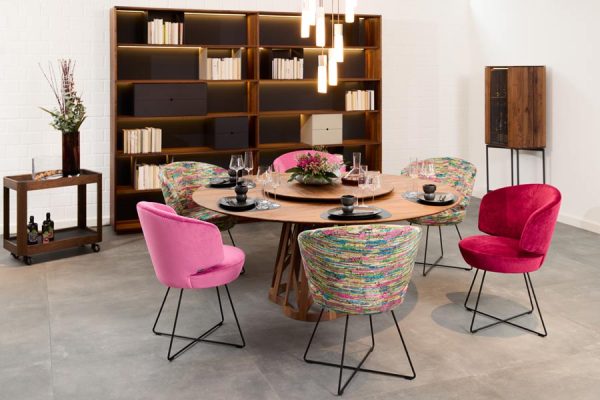 Colorful upholstered armchairs and sofa by Werther in showroom