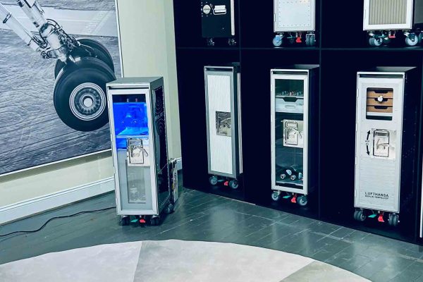 518 North showroom – wall display of Boardbar airline trolleys next to a large black-and-white airplane wheel photograph