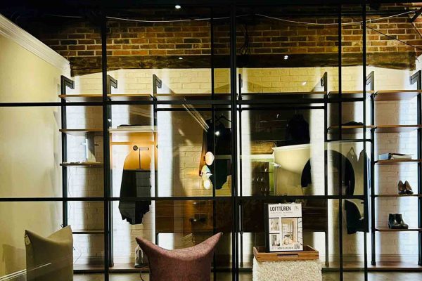 518 North showroom – Ars Nova illuminated closet and shelving system with glass-and-steel framing in a modern loft-style interior